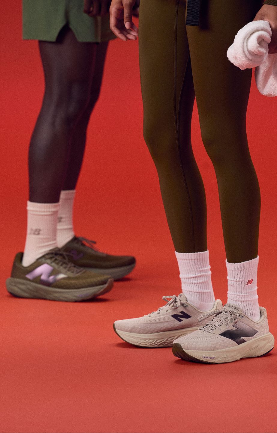 Two people wearing new balance 1080s